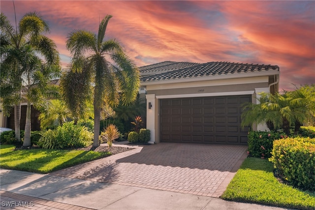 mediterranean / spanish-style home featuring a garage