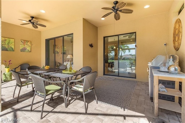 view of patio featuring outdoor dining space and ceiling fan