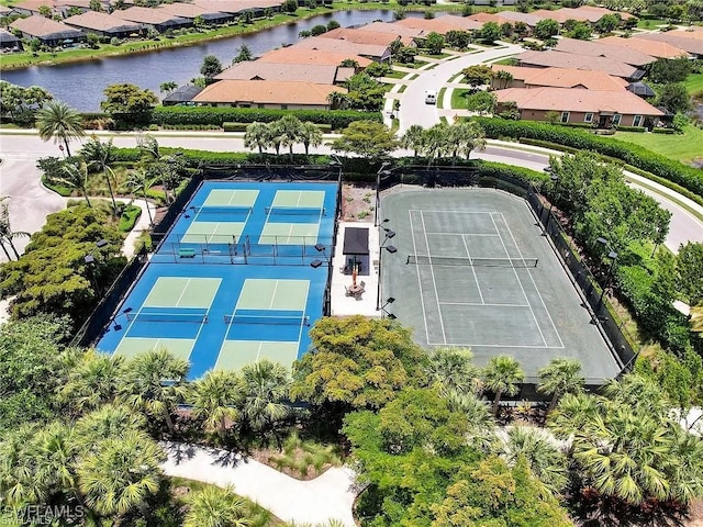 birds eye view of property with a residential view and a water view