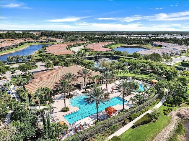 bird's eye view with a residential view and a water view