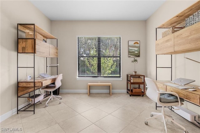 office featuring light tile patterned floors and baseboards