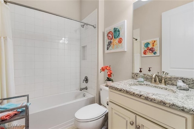 full bath featuring shower / bath combo with shower curtain, toilet, and vanity