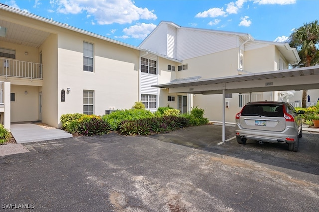 14987 Rivers Edge Ct Unit 139, Fort Myers, FL 33908 - view of property featuring covered parking