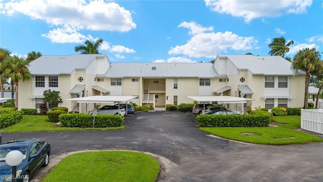 14987 Rivers Edge Ct Unit 139, Fort Myers, FL 33908 - view of property featuring covered and uncovered parking and a residential view