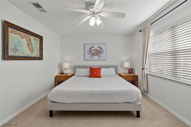 14987 Rivers Edge Ct Unit 139, Fort Myers, FL 33908 - carpeted bedroom with a textured ceiling, baseboards, a ceiling fan, and multiple windows