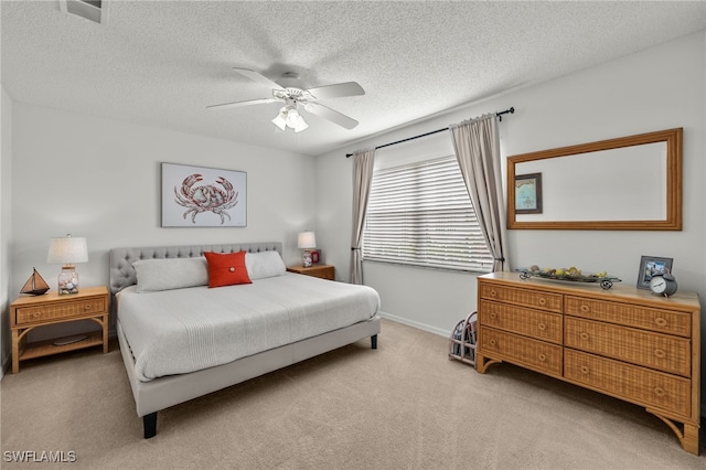 14987 Rivers Edge Ct Unit 139, Fort Myers, FL 33908 - bedroom featuring light carpet, a textured ceiling, baseboards, and ceiling fan