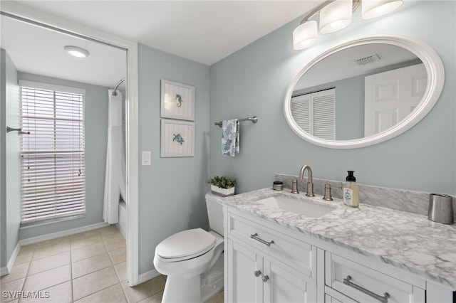 full bathroom featuring vanity, tile patterned flooring, toilet, and shower / bathtub combination