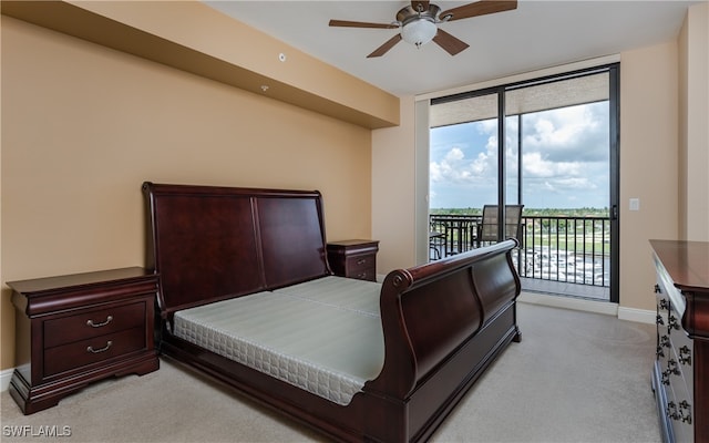 bedroom with access to outside and ceiling fan