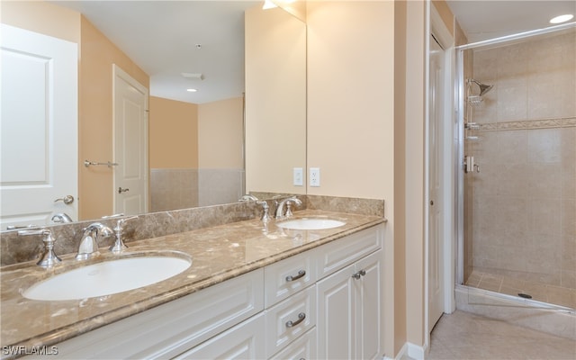 bathroom featuring vanity and a shower with door