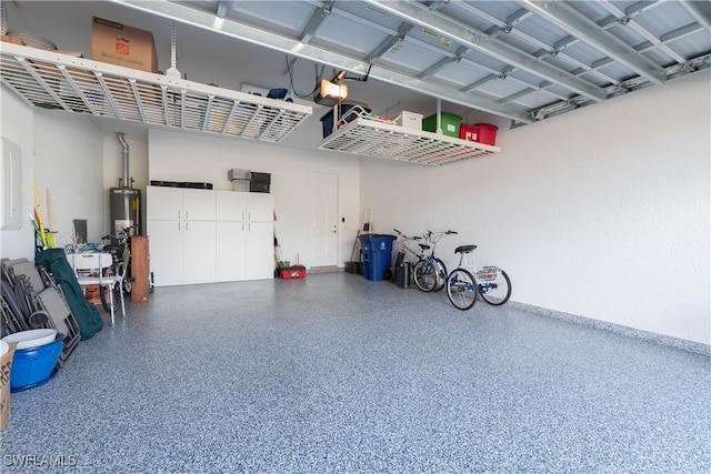 garage with a garage door opener and electric panel