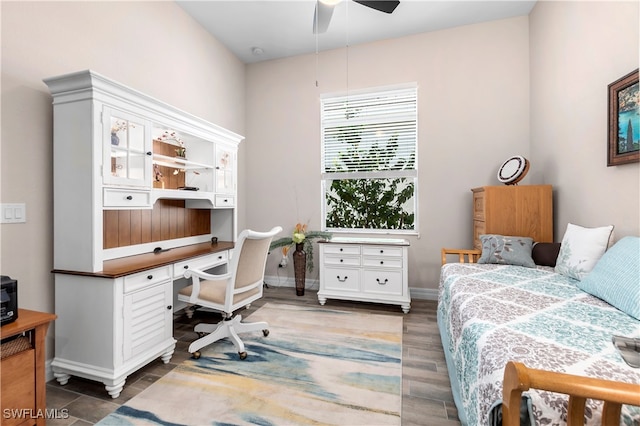 bedroom with ceiling fan and dark hardwood / wood-style flooring