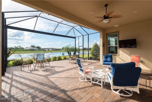 view of patio / terrace with a lanai and ceiling fan