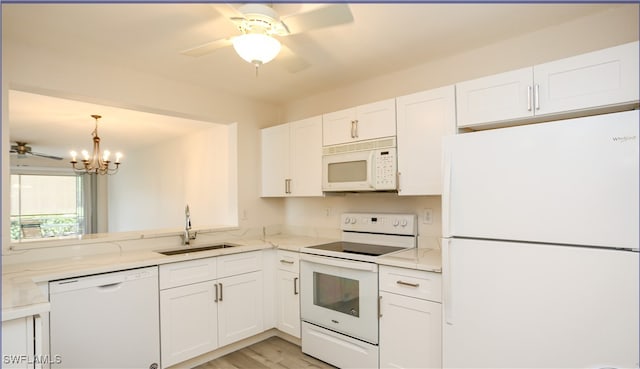 kitchen with white appliances, sink, light hardwood / wood-style flooring, and white cabinets