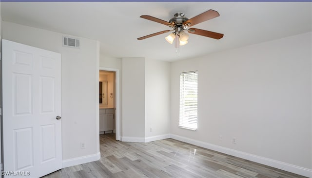 unfurnished room featuring light hardwood / wood-style flooring and ceiling fan