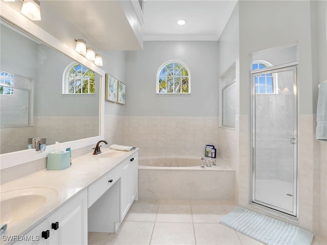 bathroom with ornamental molding, vanity, tile patterned floors, and a healthy amount of sunlight