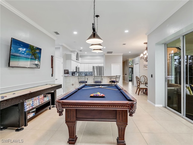 rec room with a notable chandelier, light tile patterned floors, billiards, and crown molding