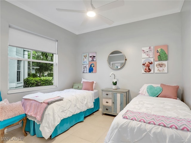 tiled bedroom featuring ceiling fan and crown molding