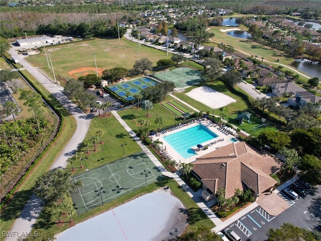 birds eye view of property with a water view