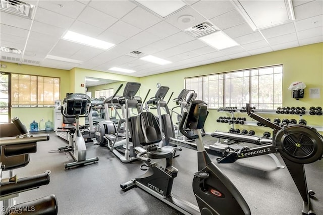 gym with a paneled ceiling