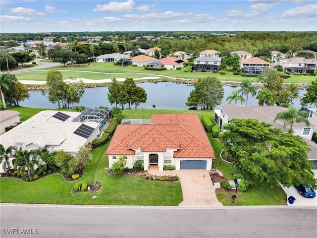 aerial view featuring a residential view and a water view