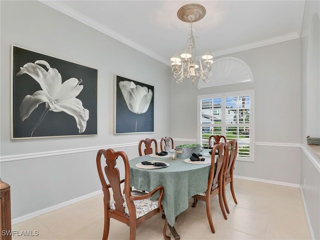 tiled dining room featuring crown molding and an inviting chandelier