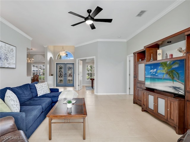 living room with ceiling fan with notable chandelier, light tile patterned floors, and ornamental molding