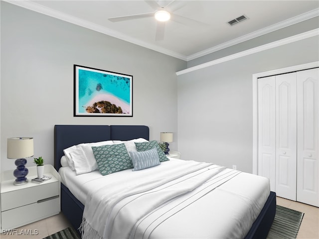 bedroom with light tile patterned flooring, ceiling fan, crown molding, and a closet