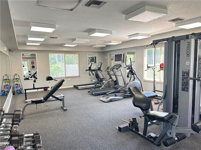 workout area with a textured ceiling