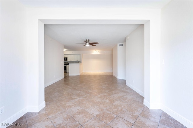 unfurnished room with ceiling fan