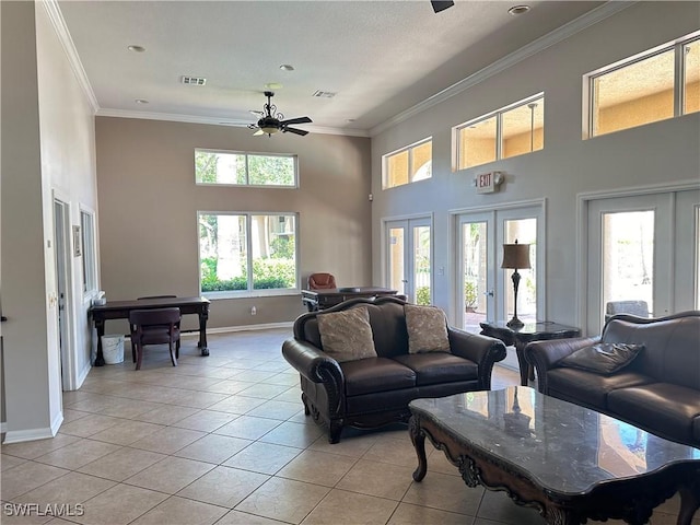 living room featuring french doors, light tile patterned floors, ceiling fan, and ornamental molding