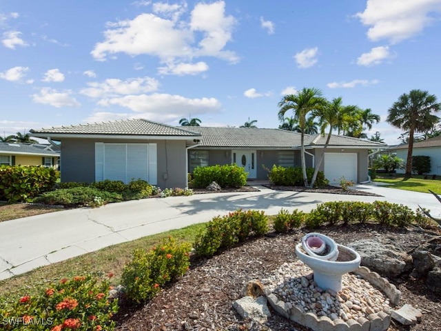 1258 Jamaica Rd, Marco Island, FL 34145 - single story home featuring a garage, stucco siding, a tiled roof, and concrete driveway