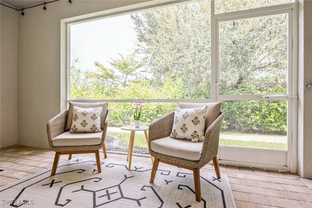 sunroom / solarium featuring a wealth of natural light