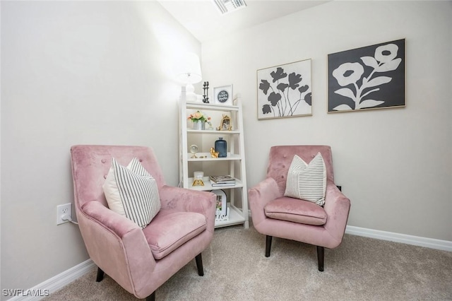 sitting room with carpet, visible vents, and baseboards