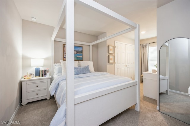 carpeted bedroom featuring a closet