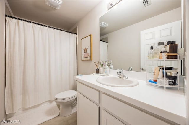 bathroom featuring tile patterned floors, toilet, vanity, and a shower with curtain