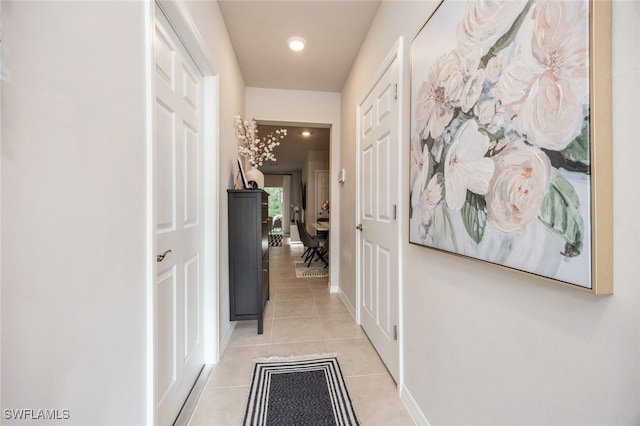 corridor featuring light tile patterned flooring