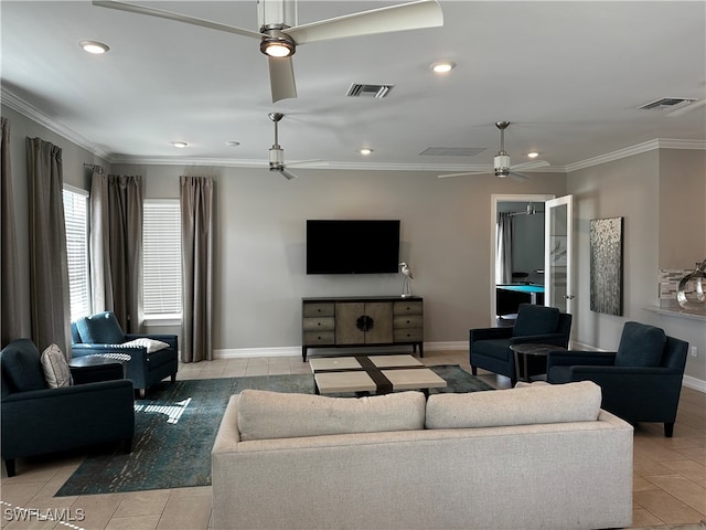 tiled living room with ceiling fan and ornamental molding