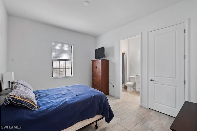 bedroom featuring connected bathroom