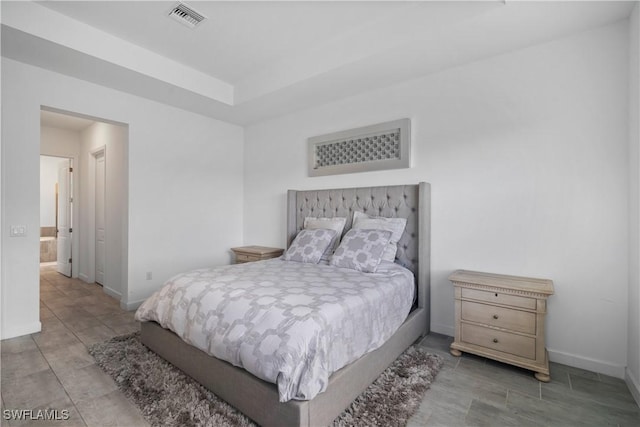 bedroom with light tile patterned floors, baseboards, and visible vents