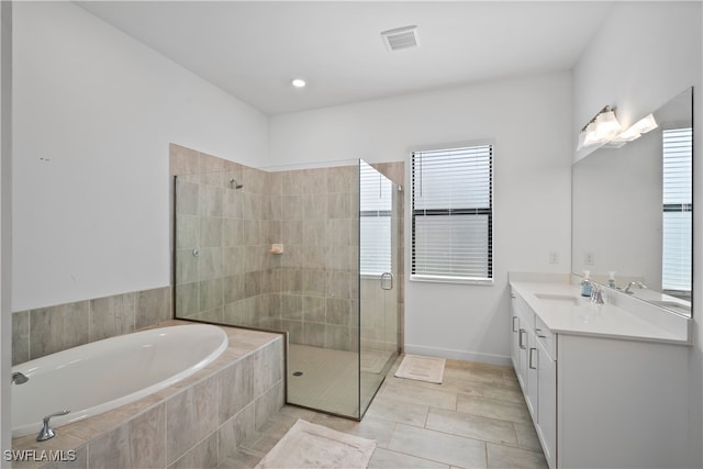 bathroom with vanity, independent shower and bath, and tile patterned flooring