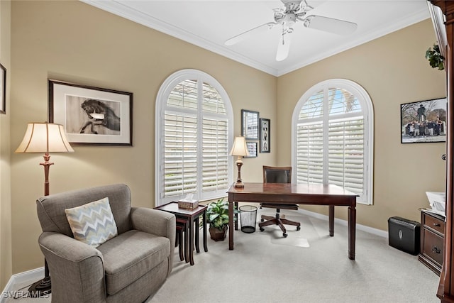 carpeted office space featuring ceiling fan and crown molding