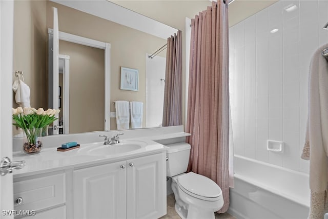 full bathroom with vanity, shower / bath combo, and toilet