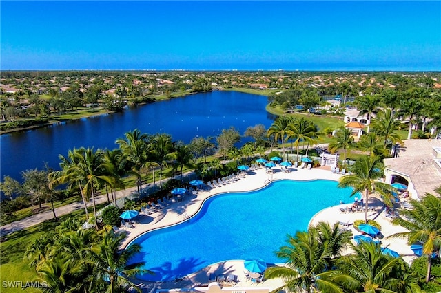 view of pool featuring a patio and a water view