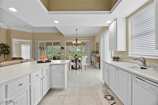 kitchen with decorative light fixtures, white dishwasher, white cabinetry, and sink