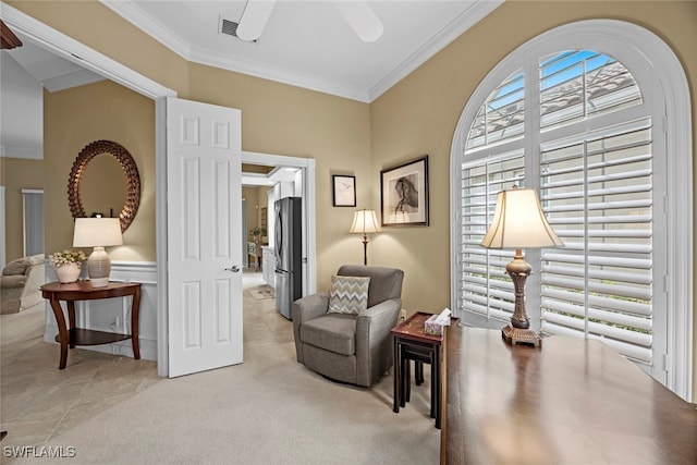 sitting room featuring light carpet and ornamental molding