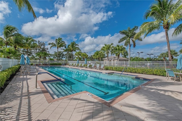 view of swimming pool with a patio