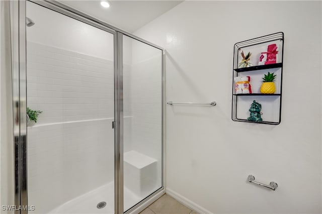 bathroom featuring tile patterned flooring and a shower with door