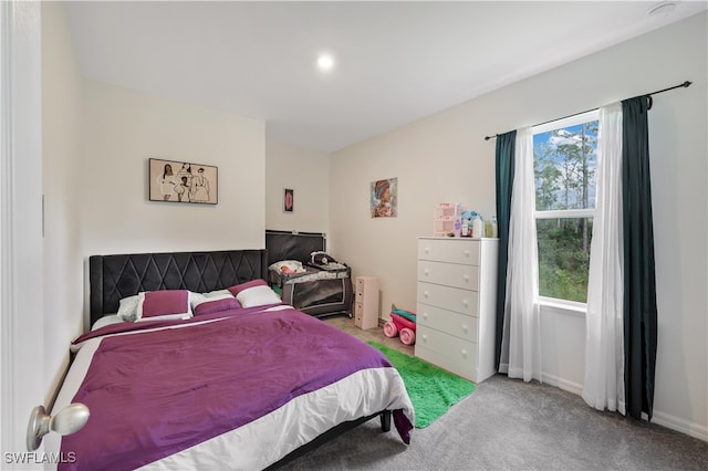 bedroom featuring carpet flooring and multiple windows