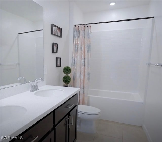 full bathroom with shower / bath combo, vanity, toilet, and tile patterned floors