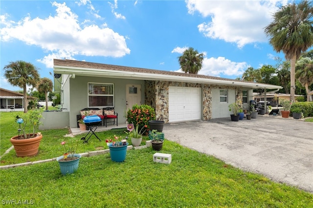 single story home featuring a garage and a front lawn